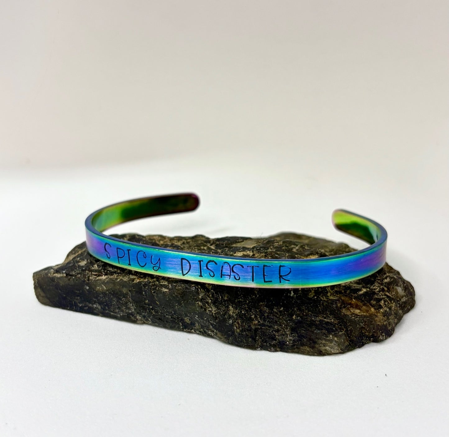 Spicy Disaster Iridescent Cuff Bracelet – Hand-Stamped Rainbow Stainless Steel Jewelry