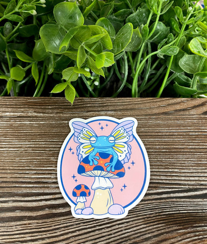 Frog w/ Wings Sitting on Mushroom, Die Cut Vinyl Sticker, Boho Fun, Water Resistant, Fungi Shrooms Toadstool |Sticker or Magnet